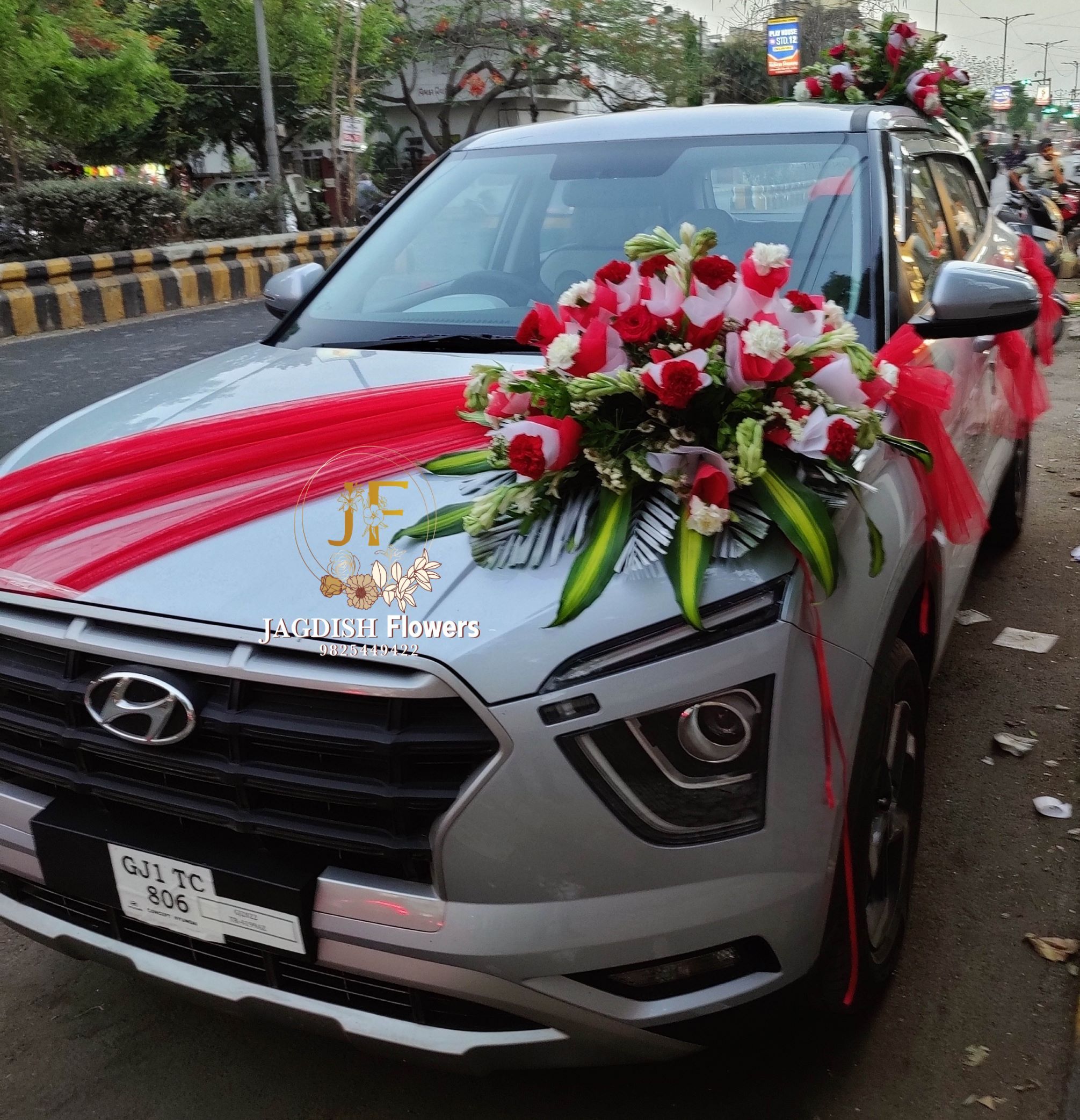 Red and White Carnesium Bouquet with Front Red Cross Net Car
