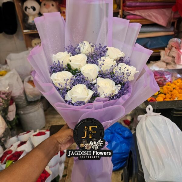white roses  with purple   gypso  bouquet