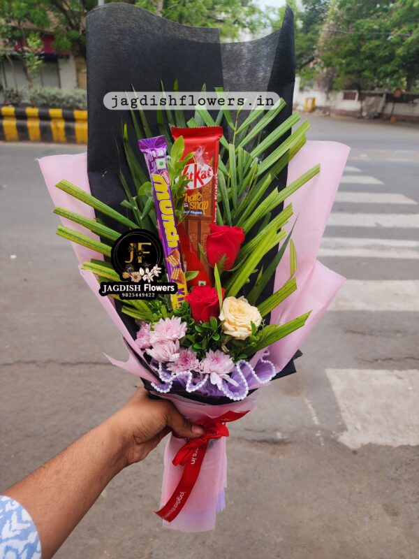 black and white paper chocolates and roses bouquet