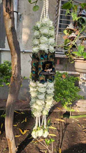 Wedding  mala of white roses gypso and peacock feather | BY JAGDISH FLOWERS